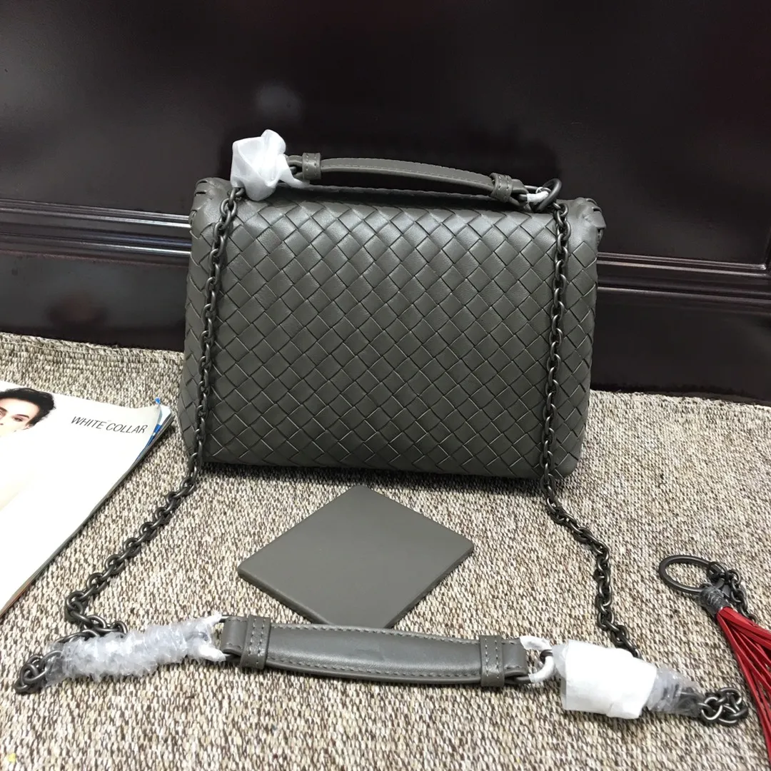 Original quality👉🏻Size 1099 Small🔥🔥Mini version of the classic Olimpia handbag, all made of Intrecciato soft sheepskin. The long Brunito polished chain adjustable strap can be doubled in length and can be used as a shoulder bag, which is both elegant and practical. The interior is lined with pigskin, and the space is separated by zippers for easy storage and organization. Built-in vanity mirror. size: 22*8*15 steel gray